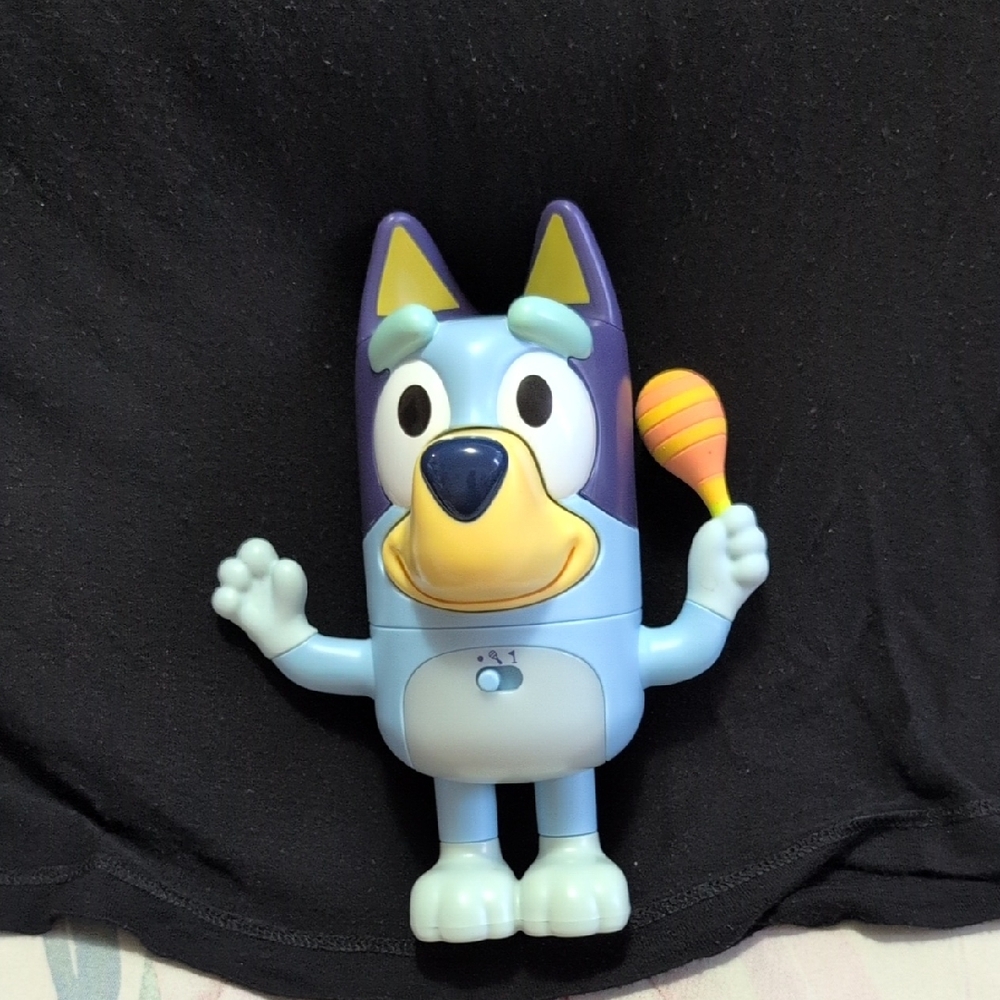 Blue and Purple Action Figure with Maraca